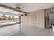 Spacious garage with epoxy flooring, built-in storage, and an open view to the outside at 15701 W Huron Dr, Sun City West, AZ 85375