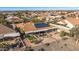 Beautiful outdoor space featuring a covered patio, artificial turf, desert landscaping and solar panels at 15701 W Huron Dr, Sun City West, AZ 85375