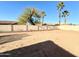 Large fenced-in backyard with mature trees, offering privacy and a peaceful setting at 1636 E Marigold St, Casa Grande, AZ 85122