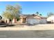 Charming single-story home with a three-car garage and well-manicured front yard at 1636 E Marigold St, Casa Grande, AZ 85122