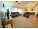 An open living room with wood floors, natural light, and a piano at 1636 E Marigold St, Casa Grande, AZ 85122