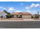 Charming single-story home featuring a tile roof, desert landscaping, and an attached two-car garage at 1651 E Kielly Ln, Casa Grande, AZ 85122