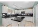 Bright kitchen with island, tile floors, plenty of counter space, and modern appliances at 1651 E Kielly Ln, Casa Grande, AZ 85122