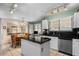 Bright kitchen features black countertops, modern appliances and a cozy breakfast nook at 1651 E Kielly Ln, Casa Grande, AZ 85122