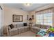 Cozy living room with patterned sofas, a window view, and a relaxed atmosphere at 1651 E Kielly Ln, Casa Grande, AZ 85122