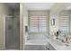 Inviting main bathroom with a separate shower, soaking tub, and bright vanity area at 1651 E Kielly Ln, Casa Grande, AZ 85122