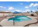 Enjoy a backyard oasis with a sparkling pool, lounge chairs, and a serene outdoor space perfect for relaxation at 1651 E Kielly Ln, Casa Grande, AZ 85122