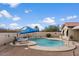 Inviting backyard pool surrounded by lush landscaping, lounge chairs, and a peaceful atmosphere for outdoor enjoyment at 1651 E Kielly Ln, Casa Grande, AZ 85122