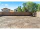 Spacious backyard with block wall, ready for landscaping at 1655 W Wilson Ave, Coolidge, AZ 85128