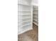 Walk-in closet featuring multiple levels of built-in shelving at 1655 W Wilson Ave, Coolidge, AZ 85128