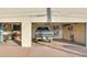 Spacious three car garage featuring large storage cabinets and a black pickup truck at 1775 N Starr Rd, Apache Junction, AZ 85119