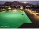 Night view of pool area with desert landscaping at 1775 N Starr Rd, Apache Junction, AZ 85119