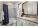 Bright bathroom features granite countertops, tiled shower, and bathtub, plus a large mirror above the vanity at 18024 E Wolf Tree Ln, Rio Verde, AZ 85263