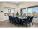 The dining room showcases large windows, a wine bar and seating for twelve guests at 18024 E Wolf Tree Ln, Rio Verde, AZ 85263