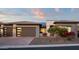 Beautiful single-story home featuring a two-car garage and desert landscaping at 18024 E Wolf Tree Ln, Rio Verde, AZ 85263