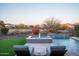 Inviting pool with lounge chairs offering serene backyard views and desert landscape at 18024 E Wolf Tree Ln, Rio Verde, AZ 85263