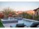 Refreshing pool with fountain feature and scenic mountain views at 18024 E Wolf Tree Ln, Rio Verde, AZ 85263