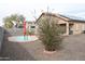 Backyard featuring desert landscaping, a small pool, and ample space for entertaining at 1813 N Lewis Pl, Casa Grande, AZ 85122