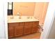 Bathroom with tile flooring, a toilet, and double sink vanity with a mirror at 1813 N Lewis Pl, Casa Grande, AZ 85122