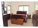 Bedroom with furniture and multiple windows at 1813 N Lewis Pl, Casa Grande, AZ 85122