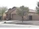 Inviting single-story home with a desert landscape, two-car garage, and easy street access at 1813 N Lewis Pl, Casa Grande, AZ 85122