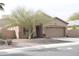 Attractive single-story home featuring a desert landscape, two car garage, and classic stucco finish at 1813 N Lewis Pl, Casa Grande, AZ 85122