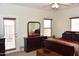 Bright main bedroom featuring an exit to the backyard and a large dresser at 1813 N Lewis Pl, Casa Grande, AZ 85122