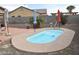 A quaint, private pool features a serene escape with a stone surround and low-maintenance landscaping at 1813 N Lewis Pl, Casa Grande, AZ 85122