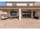 Covered back patio features ceiling fans and ample seating space at 18609 W Diana Ave, Waddell, AZ 85355