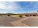 Large backyard featuring pergola, gravel accents, and playground at 18609 W Diana Ave, Waddell, AZ 85355