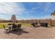 Spacious brick backyard featuring dining and barbeque areas at 18609 W Diana Ave, Waddell, AZ 85355