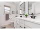 Bright bathroom featuring dual vanities, modern fixtures, and a neutral color scheme at 18609 W Diana Ave, Waddell, AZ 85355