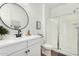 Bright bathroom with a glass-enclosed shower and modern fixtures at 18609 W Diana Ave, Waddell, AZ 85355