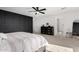 Bedroom features a dark accent wall and an ensuite bathroom at 18609 W Diana Ave, Waddell, AZ 85355