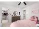 Charming bedroom featuring a dresser, walk-in closet, and neutral color scheme at 18609 W Diana Ave, Waddell, AZ 85355