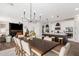 Spacious dining area with view of living room and modern kitchen at 18609 W Diana Ave, Waddell, AZ 85355