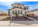 Beautiful exterior elevation featuring a manicured yard with a stone accent and covered porch at 18609 W Diana Ave, Waddell, AZ 85355