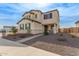 Charming two-story home with a covered porch and manicured landscaping at 18609 W Diana Ave, Waddell, AZ 85355