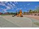 Community playground with slide and climbing structure offers a fun and safe space for children to play at 18609 W Diana Ave, Waddell, AZ 85355