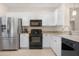 Well-equipped kitchen with granite countertops and stainless steel refrigerator at 18668 N Lariat Ct, Surprise, AZ 85387