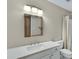 Bathroom featuring quartz countertops, modern vanity, and a large framed mirror above the sink at 1930 S Westwood Dr # 29, Mesa, AZ 85210