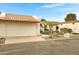 Inviting home featuring an attached garage, arched entryway, and xeriscaped front yard at 1930 S Westwood Dr # 29, Mesa, AZ 85210