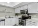 Well-equipped kitchen showcasing stainless steel appliances, white cabinetry, and modern fixtures at 1930 S Westwood Dr # 29, Mesa, AZ 85210