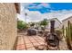 Charming backyard featuring a tiled area, desert landscaping, and a rustic chiminea at 1973 E Buena Vista Dr, Chandler, AZ 85249