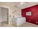 Cozy bedroom featuring a ceiling fan and a brightly painted accent wall at 1973 E Buena Vista Dr, Chandler, AZ 85249