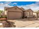 Well-maintained home featuring desert landscaping, a two-car garage, and a neutral color scheme at 1973 E Buena Vista Dr, Chandler, AZ 85249