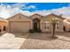 Charming single-story home with low maintenance landscaping and an attached two car garage at 1973 E Buena Vista Dr, Chandler, AZ 85249