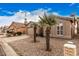 Charming home exterior with desert landscaping and mature palm trees in the front yard at 1973 E Buena Vista Dr, Chandler, AZ 85249