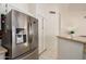 Kitchen featuring stainless steel refrigerator, white cabinetry and granite counters at 1973 E Buena Vista Dr, Chandler, AZ 85249