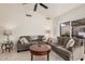 Cozy living room featuring a comfortable sofa, tile flooring, and natural light from sliding glass doors at 1973 E Buena Vista Dr, Chandler, AZ 85249